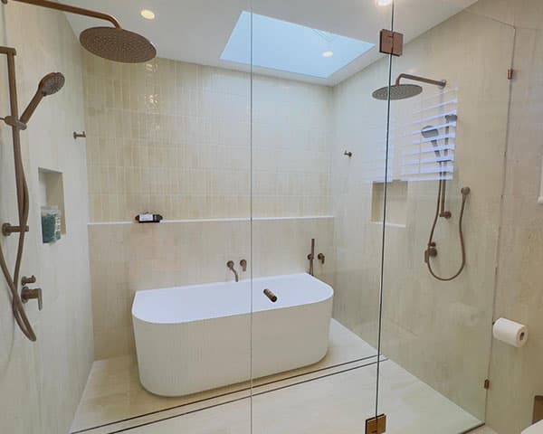 Low iron (extra-clear) glass panel with reduced green tint