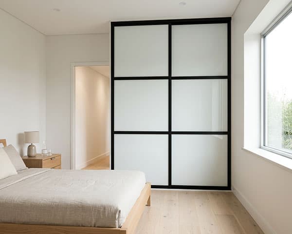 Shoji-style sliding wardrobe doors with grid detailing