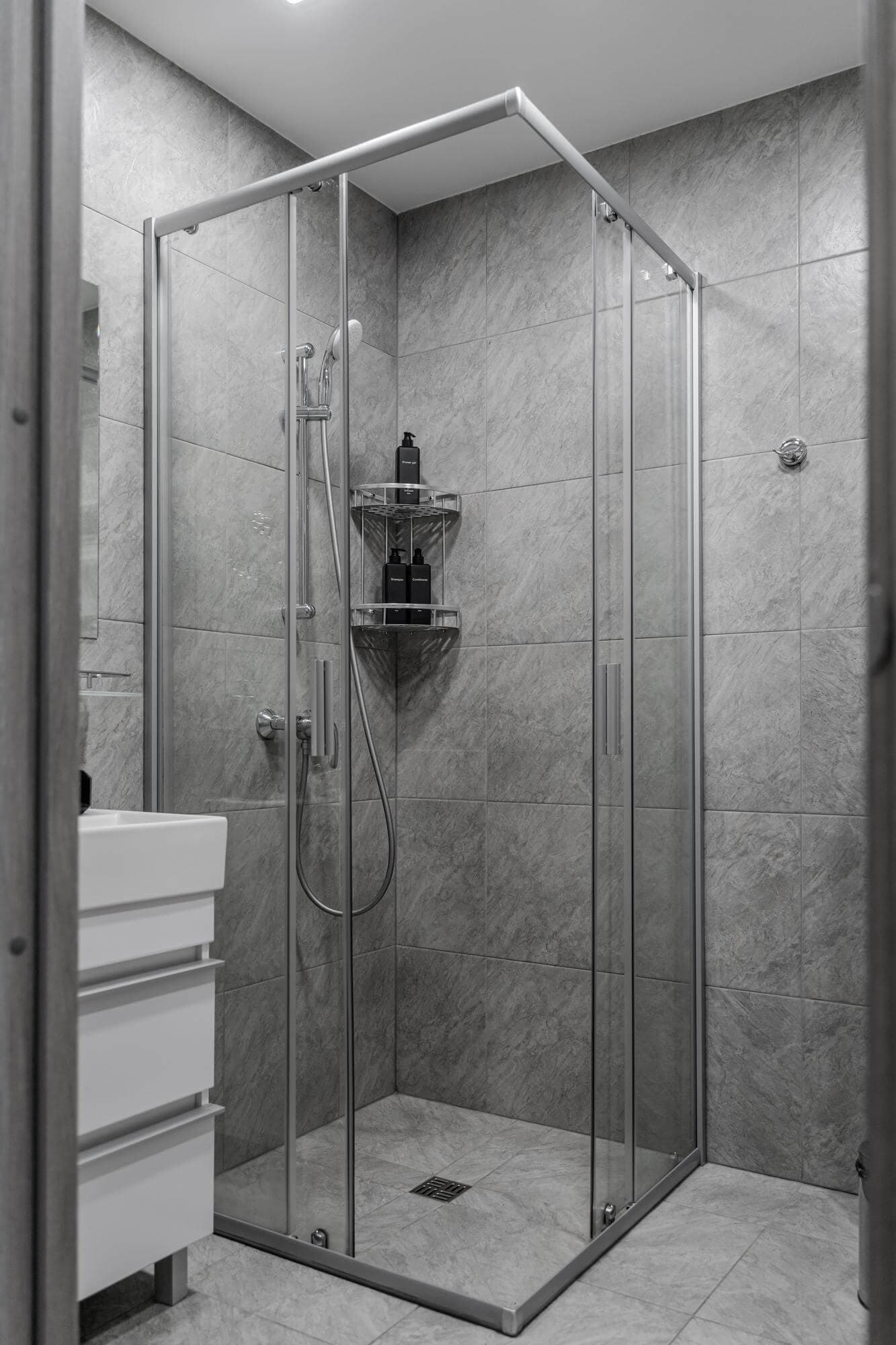 Frameless glass shower screen in a modern bathroom